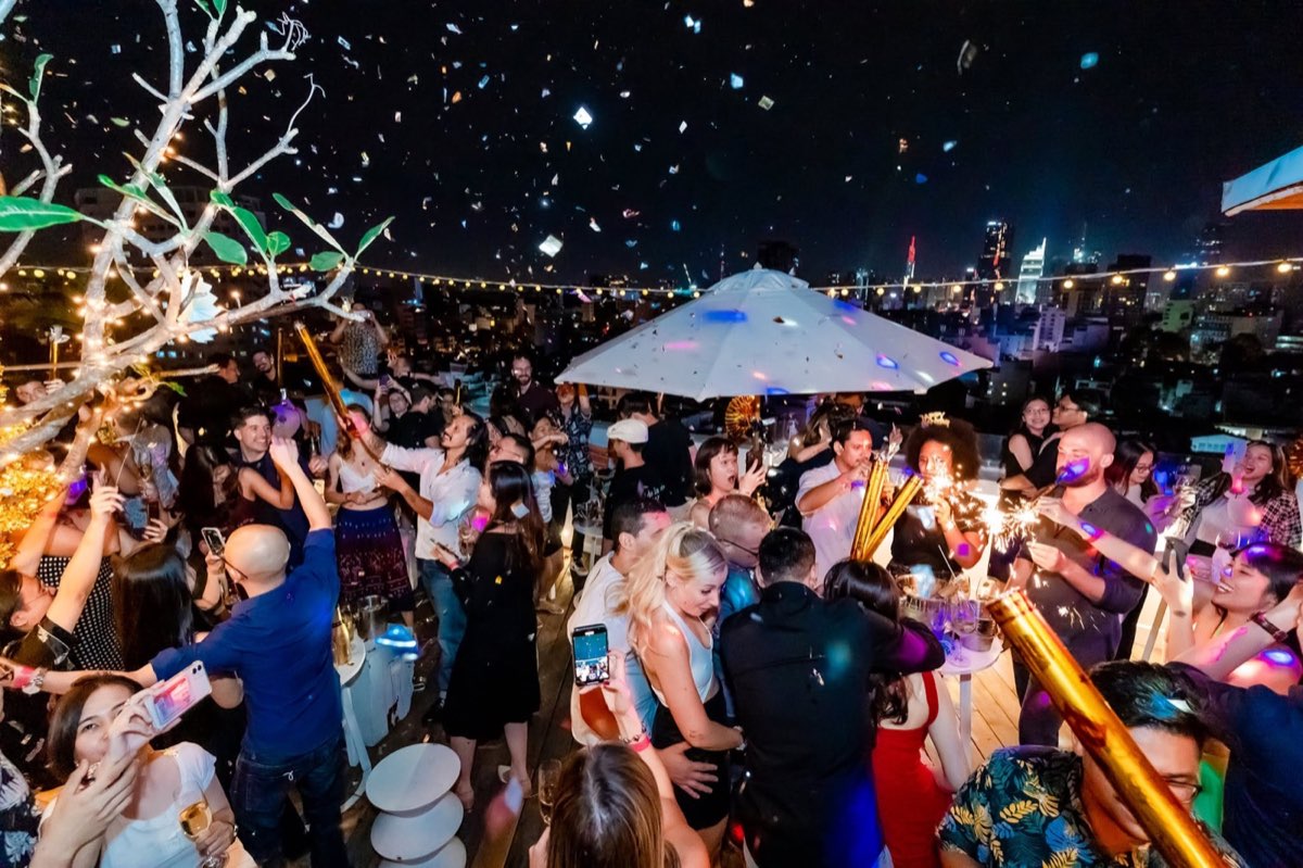 Guests dancing at Banana Mama rooftop bar